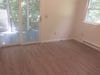 Interior of an apartment with wood flooring freshly painted white