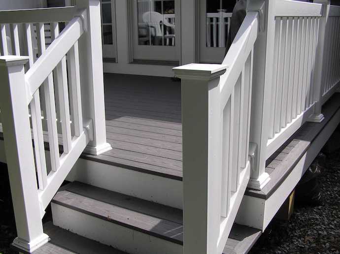Full build-out of a gray PVC Azek deck with a white PVC rail system
